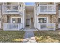 Charming exterior entry featuring private balconies, updated railings and walkway at 14493 E Jewell Ave # 103, Aurora, CO 80012