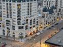 Eye-level exterior of building featuring multiple residential units with views overlooking city streets at 975 N Lincoln St # 4F, Denver, CO 80203