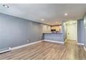 This living room features sleek, modern vinyl floors and stylish light-gray walls at 1125 N Washington St # 303, Denver, CO 80203