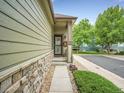 Charming entryway with a welcoming porch and landscaped surroundings at 4501 S Tabor Ct, Morrison, CO 80465