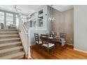 Bright dining room with hardwood floors and a chandelier at 9818 E Carolina Pl, Aurora, CO 80247