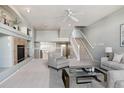 Open living room with high ceilings and a fireplace at 9818 E Carolina Pl, Aurora, CO 80247