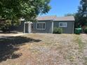 A quaint single-story home with a well-maintained lawn and simple landscaping leading up to the front door at 772 Victor St, Aurora, CO 80011