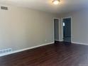 Spacious living room featuring sleek hardwood floors, neutral paint, and bright lighting at 772 Victor St, Aurora, CO 80011