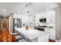Charming kitchen featuring a marble countertop island and stainless steel appliances at 1631 N Emerson St # 117, Denver, CO 80218
