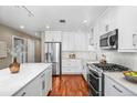 Modern kitchen with stainless steel appliances and granite countertops at 1631 N Emerson St # 117, Denver, CO 80218