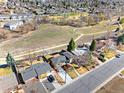 Aerial view of a charming neighborhood near open space, showcasing the property's location at 10699 W 9Th Pl, Lakewood, CO 80215