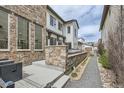 Outdoor patio with stone retaining wall and gravel pathway featuring seating at 2640 S Orchard St, Lakewood, CO 80228