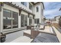 Comfortable outdoor living space on the patio, featuring a seating area and gas grill at 2640 S Orchard St, Lakewood, CO 80228