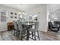 Cozy dining area with modern decor, stylish furnishings and access to outdoor area at 12233 Hannibal St, Commerce City, CO 80603