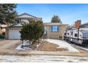 Two-story home with a driveway, landscaping, and an RV parked on the side at 5510 W 103Rd Ave, Westminster, CO 80020