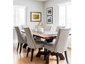 Bright dining room featuring a rustic wood table with seating for six and stylish decor at 2048 Meade St, Denver, CO 80211