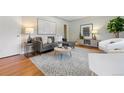 Stylish living room with hardwood floors, comfortable seating, and decorative accents at 3245 S High St, Englewood, CO 80113