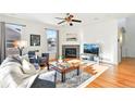 Inviting living room with a fireplace, hardwood floors, and ample natural light at 8645 Coors St, Arvada, CO 80005