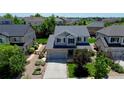 Aerial view of the property displaying the home's layout, landscaping, and surrounding neighborhood at 26072 E Fremont Pl, Aurora, CO 80016