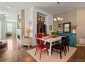 Charming dining room with hardwood floors, unique furniture, and stylish decor at 16406 W 85Th Ln # A, Arvada, CO 80007