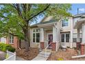 Inviting exterior showcasing a charming two-story home with manicured landscaping and a quaint front porch at 604 S Yarrow St, Lakewood, CO 80226