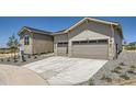Exterior shot showcasing the driveway and the two-car garage at 366 Agoseris Way, Castle Rock, CO 80104
