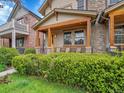 Inviting porch with wooden beams and comfortable seating, perfect for relaxation at 383 S Franklin St, Denver, CO 80209