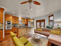 Open living room with hardwood floors and eat-in kitchen, perfect for modern living at 383 S Franklin St, Denver, CO 80209