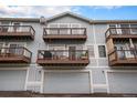 Exterior showcasing balconies and garages for each townhome unit at 6240 Everett Ct # D, Arvada, CO 80004