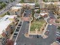 An aerial view shows the community's layout, parking, and common areas including the pool at 9019 E Panorama Cir # D320, Englewood, CO 80112