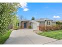 Attractive single-story home with a neatly landscaped front yard, inviting entryway and attached garage at 2330 Sandpiper Dr, Lafayette, CO 80026