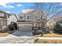Charming two-story home with a well-manicured lawn and driveway at 16404 E 117Th Ave, Commerce City, CO 80022
