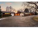 Spacious detached garage and expansive driveway that accentuates this red brick home at 7382 W Stanford Ave, Littleton, CO 80123