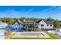 Luxury home with pool and mountain views. Features a large backyard and modern design at 11498 Evening Hunt Rd, Franktown, CO 80116