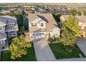 Stunning aerial view of a two-story home in a well-planned neighborhood on a sunny day at 9294 Melborne Ct, Parker, CO 80134