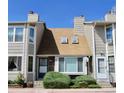 Charming townhouse with a well-maintained front yard and inviting entrance at 7978 Chase Cir # E, Arvada, CO 80003
