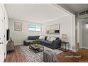 Bright living room featuring a comfortable sectional sofa and modern decor at 3623 S Sheridan Blvd # 8, Denver, CO 80235