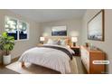 Bright bedroom with a large window, soft lighting, and a cozy bed for relaxation at 927 E 7Th Ave, Broomfield, CO 80020