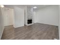 A modern living room showcases a stylish fireplace and open layout, perfect for entertaining at 927 E 7Th Ave, Broomfield, CO 80020