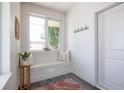 Bright entryway featuring a built-in bench, a welcome sign, and decorative accents at 2197 S Clermont St, Denver, CO 80222
