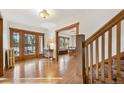 Hardwood floors, staircase, and view into dining area at 1650 Monaco St Pkwy, Denver, CO 80220