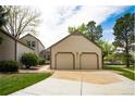 Charming home with a two-car garage, well-maintained lawn, and mature trees at 6468 S Hudson St, Centennial, CO 80121