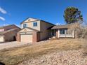 Charming two-story home with a two-car garage and manicured front yard at 805 Northridge Rd, Highlands Ranch, CO 80126