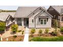 Well-manicured front yard and tasteful landscaping highlight this charming home's appealing exterior at 997 Brocade Dr, Highlands Ranch, CO 80126