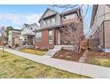 Attractive two-story home with brick accents and a welcoming front porch at 82 Oneida St, Denver, CO 80230