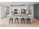 Stylish kitchen island offers bar seating and ample counter space for food preparation at 2591 Iola St, Aurora, CO 80010