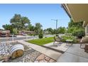 Inviting front yard with seating area offering picturesque views of the neighborhood at 6995 W 27Th Ave, Wheat Ridge, CO 80033