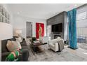 Cozy living room with modern decor, a fireplace, and plenty of natural light at 512 Cook St, Denver, CO 80206