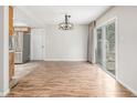 Bright dining area featuring hardwood floors and sliding glass doors at 10723 Sperry St, Northglenn, CO 80234