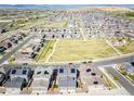 Aerial view of property showcasing community park, nearby homes and solar panels at 17614 Cherokee St, Broomfield, CO 80023