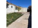 Backyard featuring a lawn, and a detached garage at 12116 N Fairfax St, Thornton, CO 80241