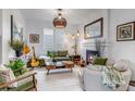 Cozy living room with fireplace, soft lighting, and stylish decor at 21658 E Tallkid Ave, Parker, CO 80138