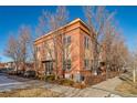 Side view of the home highlighting its architecture and landscaping at 7777 E 1St Pl # 110, Denver, CO 80230