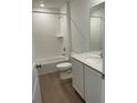 Clean bathroom featuring a shower-tub combo with white tiling and a modern vanity with a quartz countertop at 21966 E 39Th Pl, Aurora, CO 80019